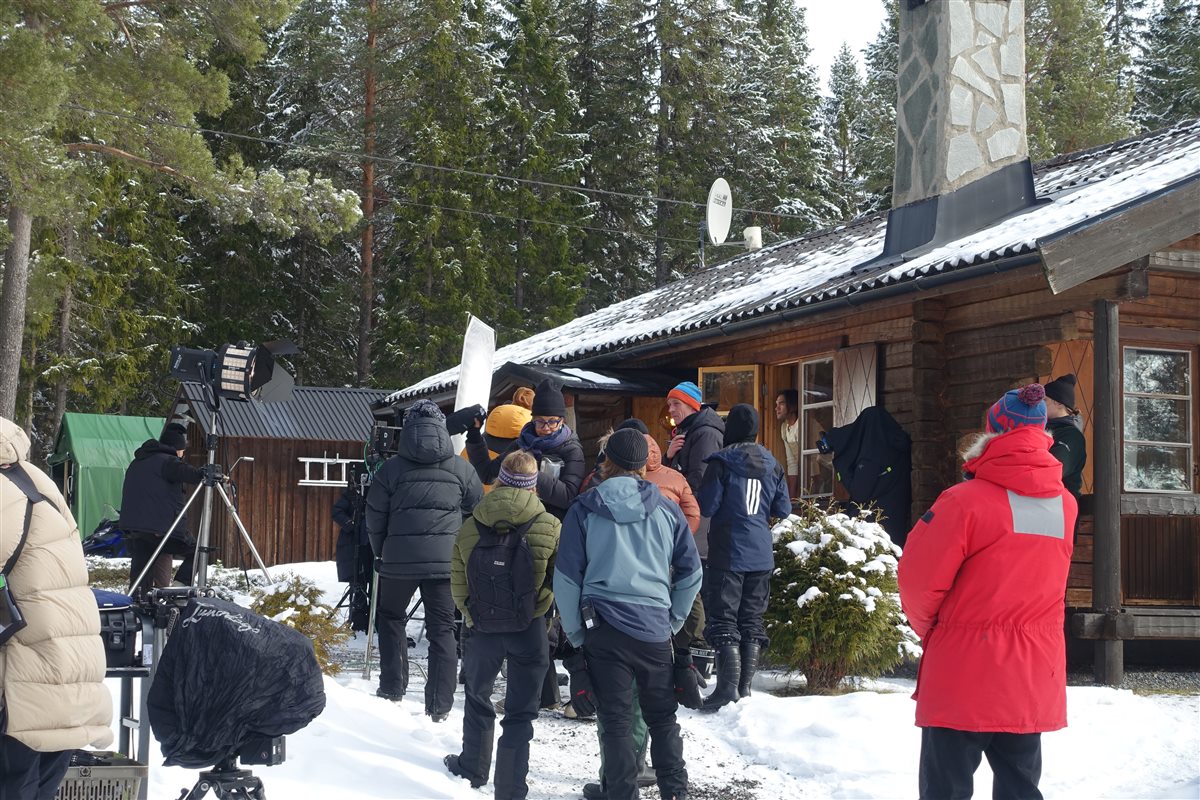 Behind the scenes from the Electrolux shoot with crew outside a mountain cabin