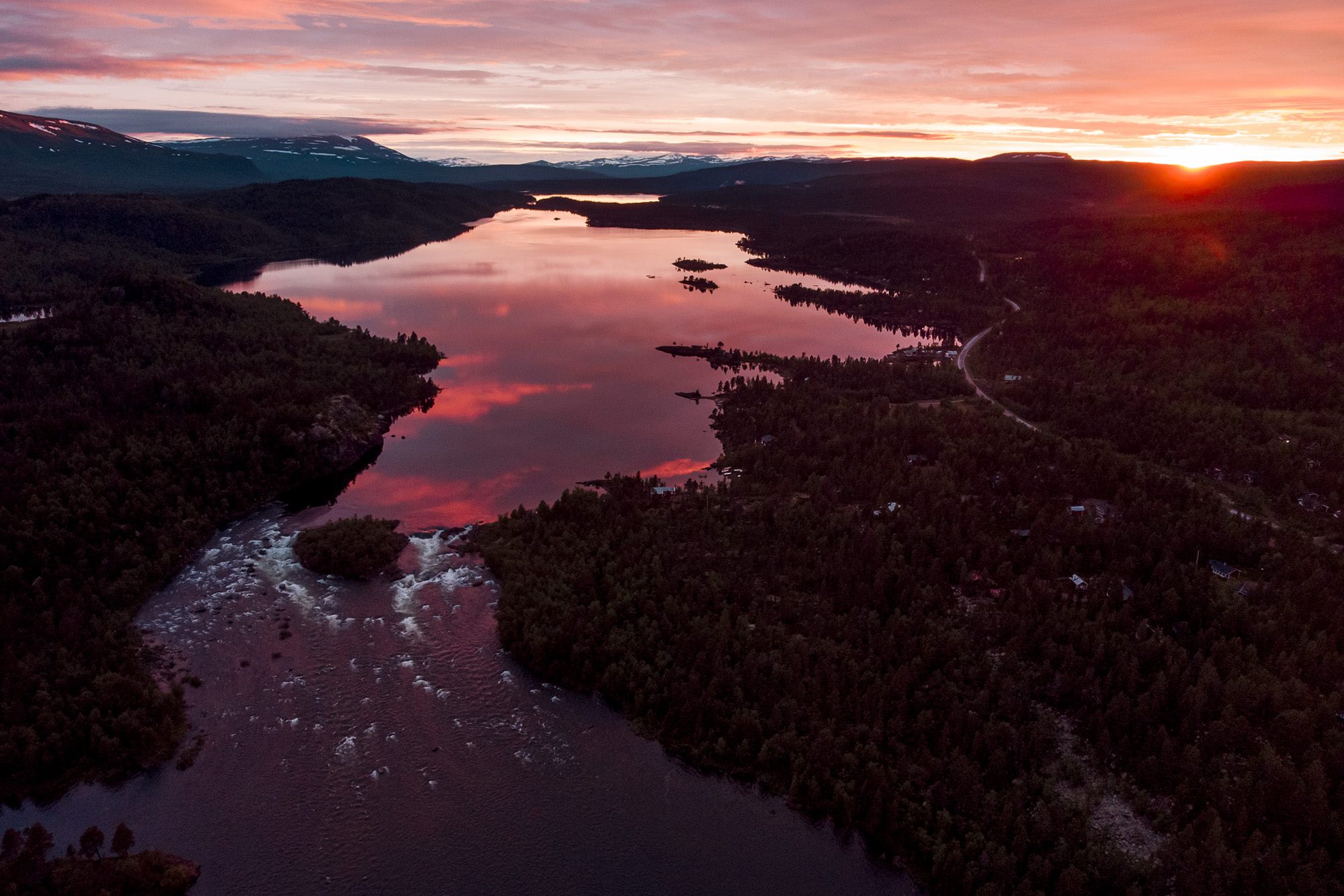 Aerial view over a lake and mountains in Northern Scandinavia