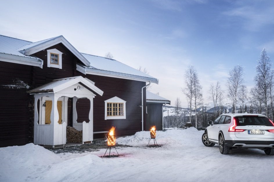 Volvo Get Away Lodge with a white Volvo outside in winter